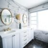 a bathroom with two sinks and a large mirror